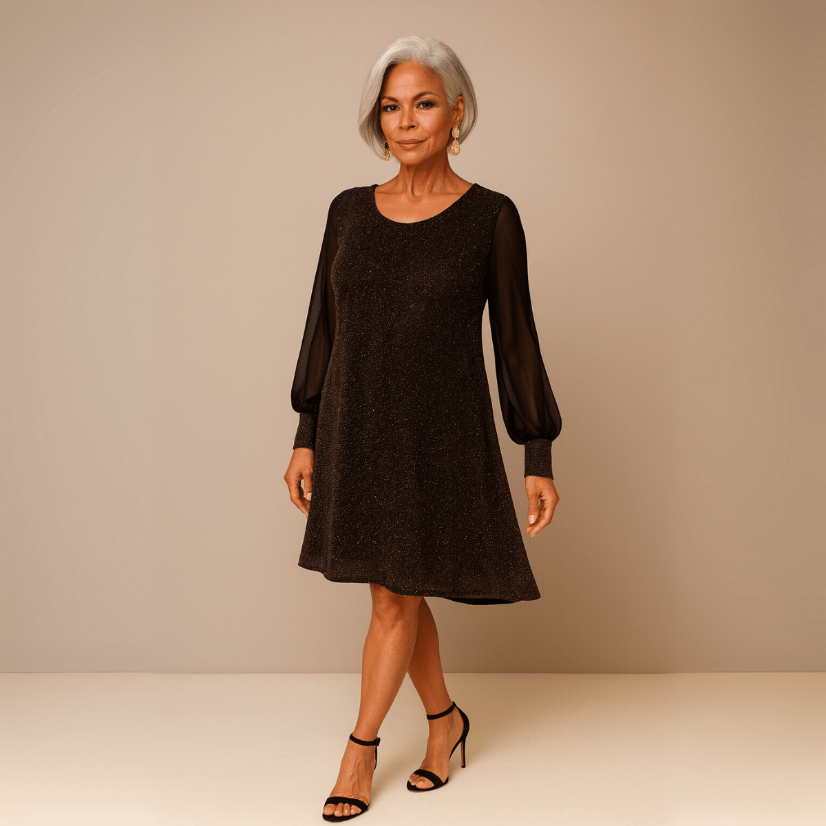 Elegant black dress featuring sheer sleeves and a flared silhouette.