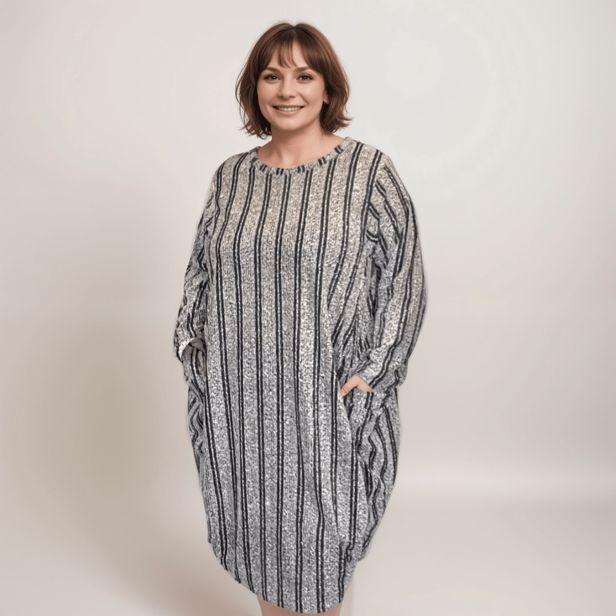 Striped oversized dress featuring pockets and a relaxed fit.