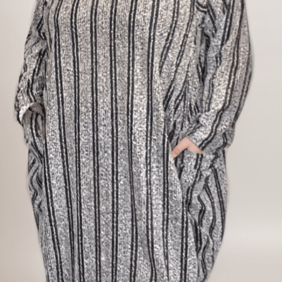Striped oversized dress featuring pockets and a cozy design.