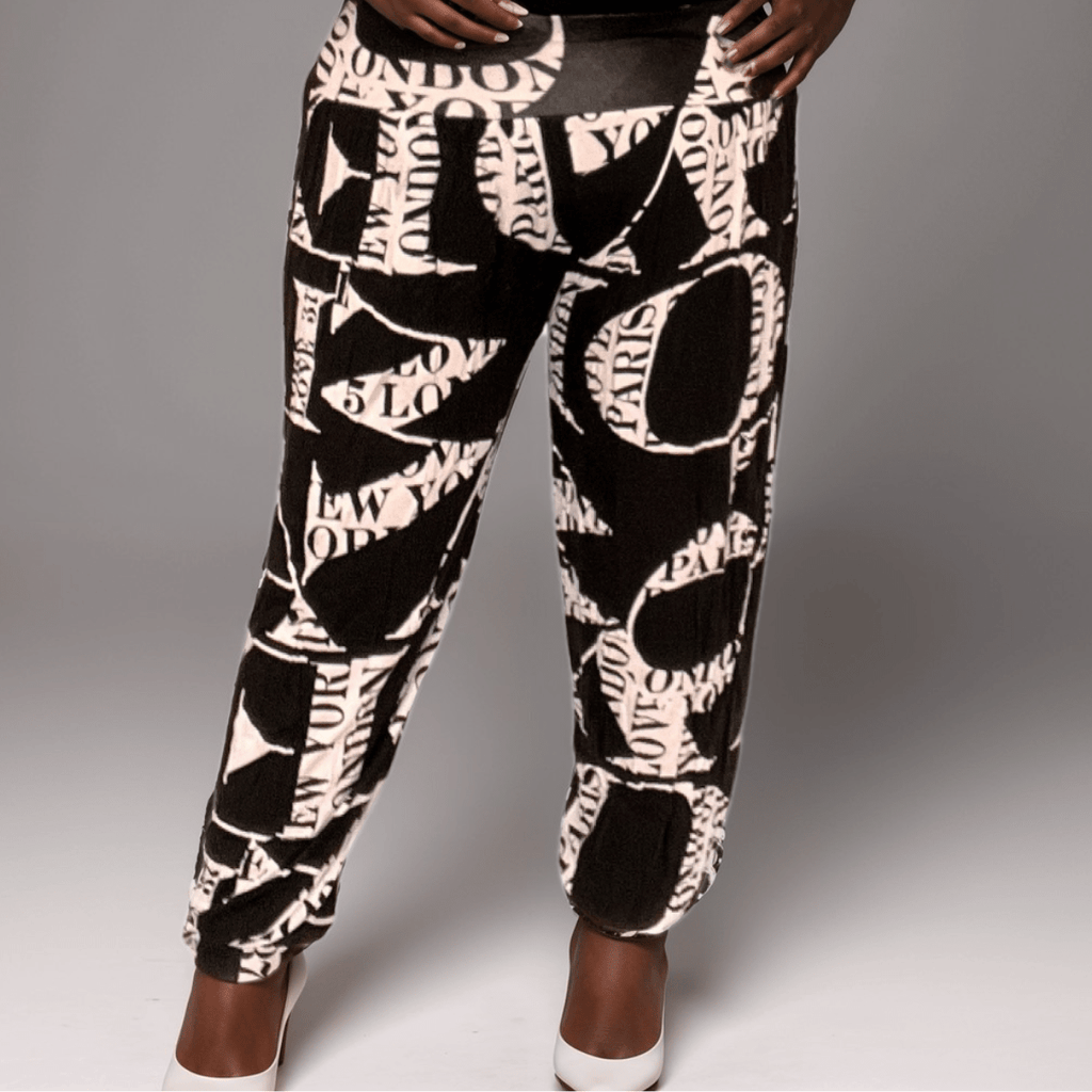 Fashionable black and white printed joggers featuring city names like London and Paris.