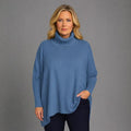 Blue Cashmere Turtleneck Sweater featuring a relaxed fit and cozy design.