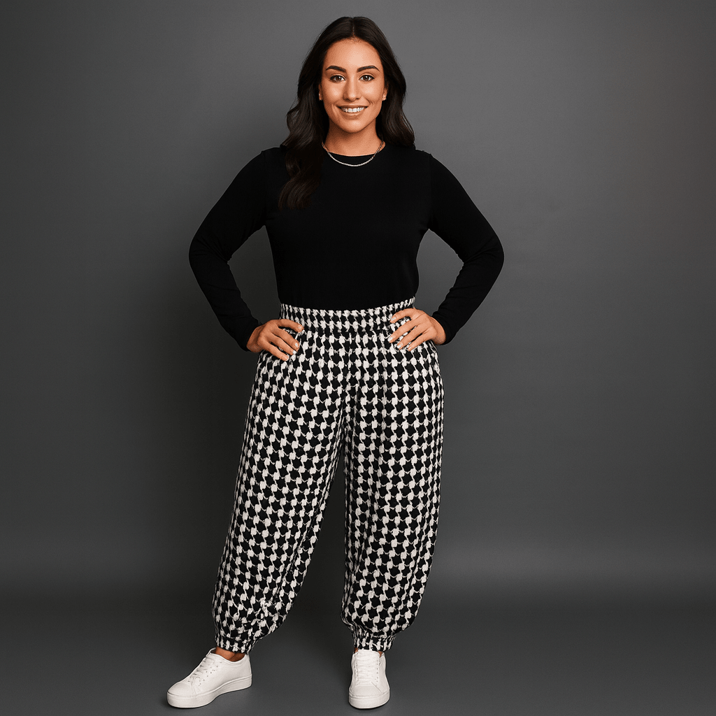 Black and white checkered pants featuring a relaxed fit and elastic cuffs.