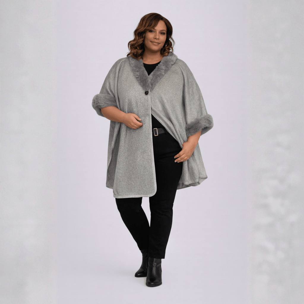 Gray cape with faux fur collar, featuring a button closure and stylish design.