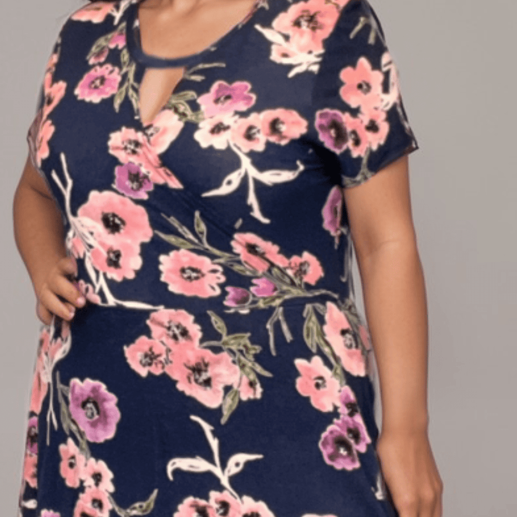 Floral Wrap Dress featuring pink and purple flowers on a navy background.