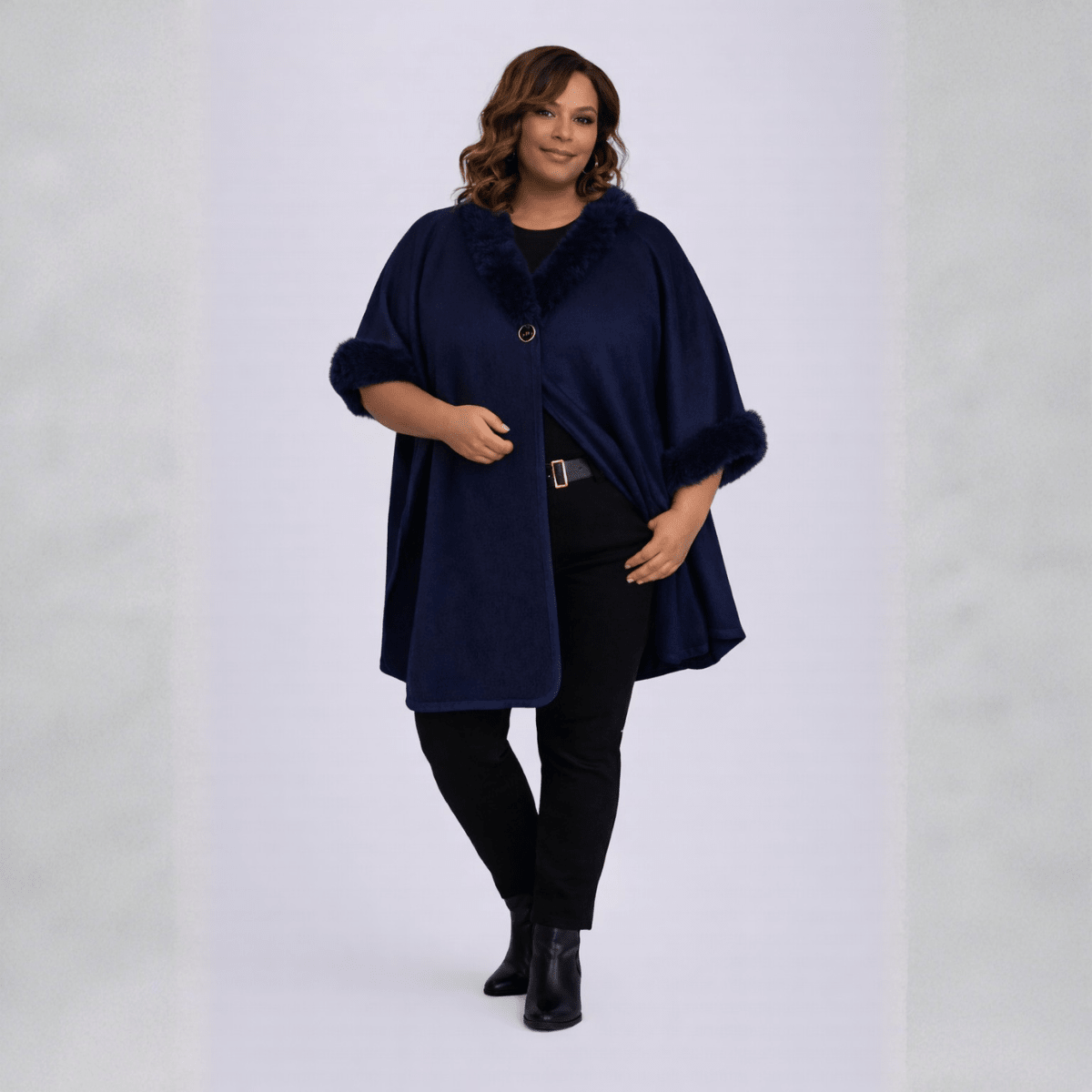 Navy Faux Fur Cape featuring a stylish collar and button closure, perfect for elegant layering.