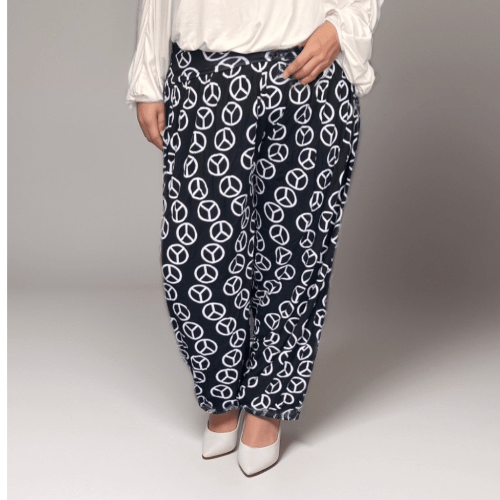 Peace Sign Pants featuring a navy background with white peace symbols, perfect for casual wear.