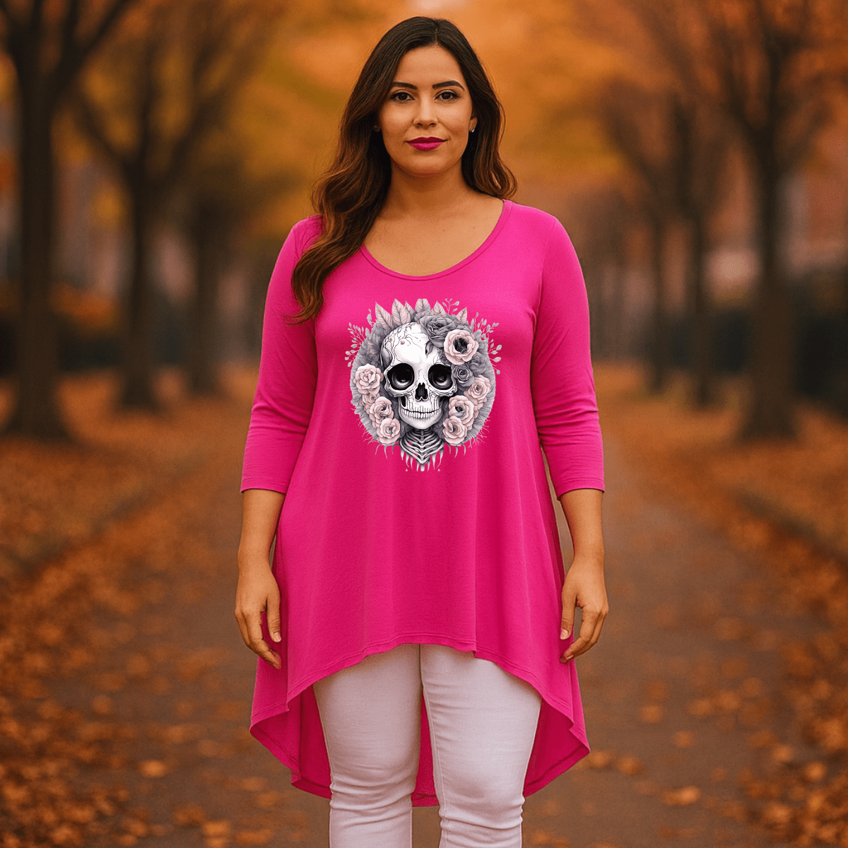 Pink Skull Graphic Tunic featuring a detailed skull design and floral accents.