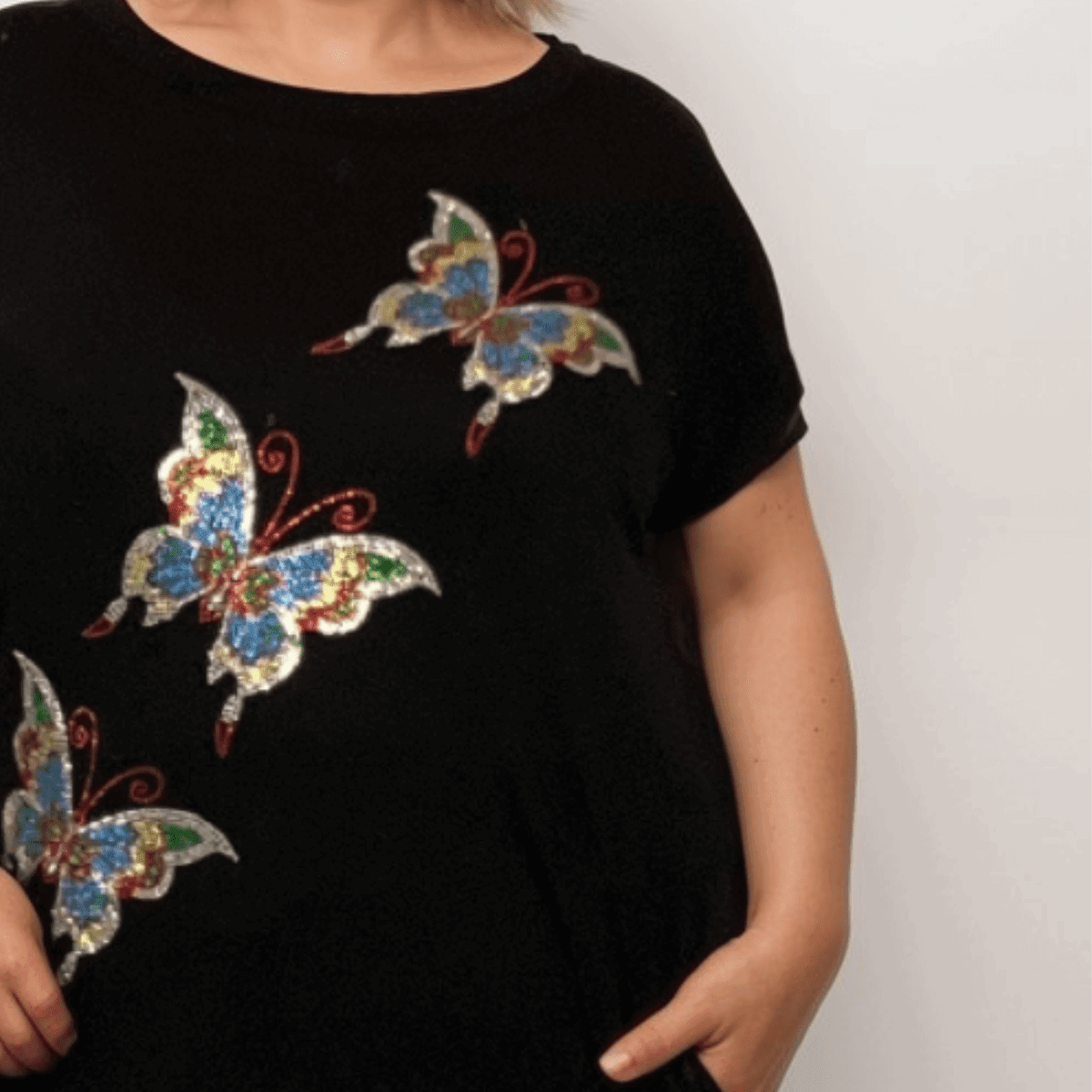 Sequin Butterfly Dipped Hem Top with Pockets - FullFab