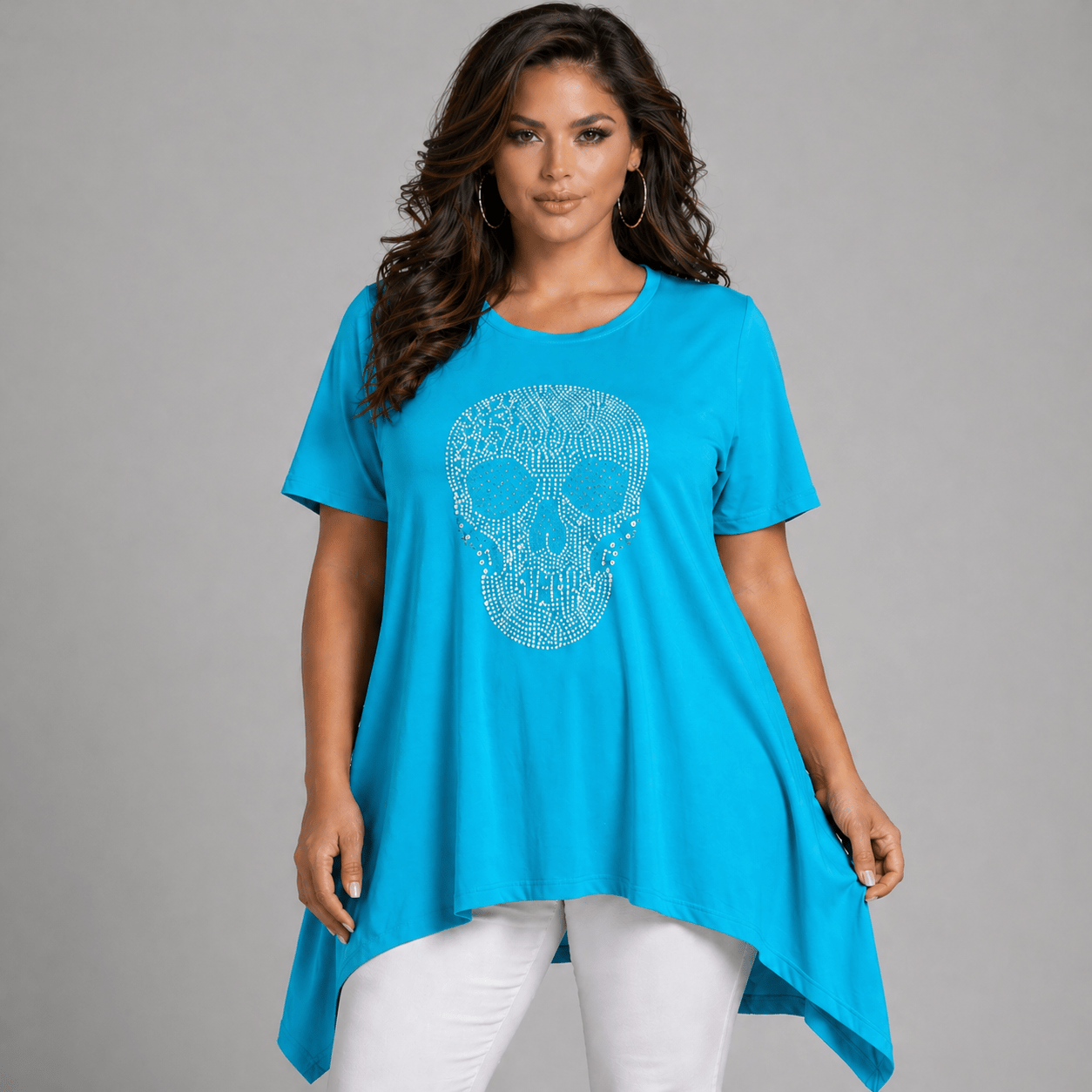 Skull Graphic Tunic in vibrant turquoise color with a stylish asymmetrical hem.