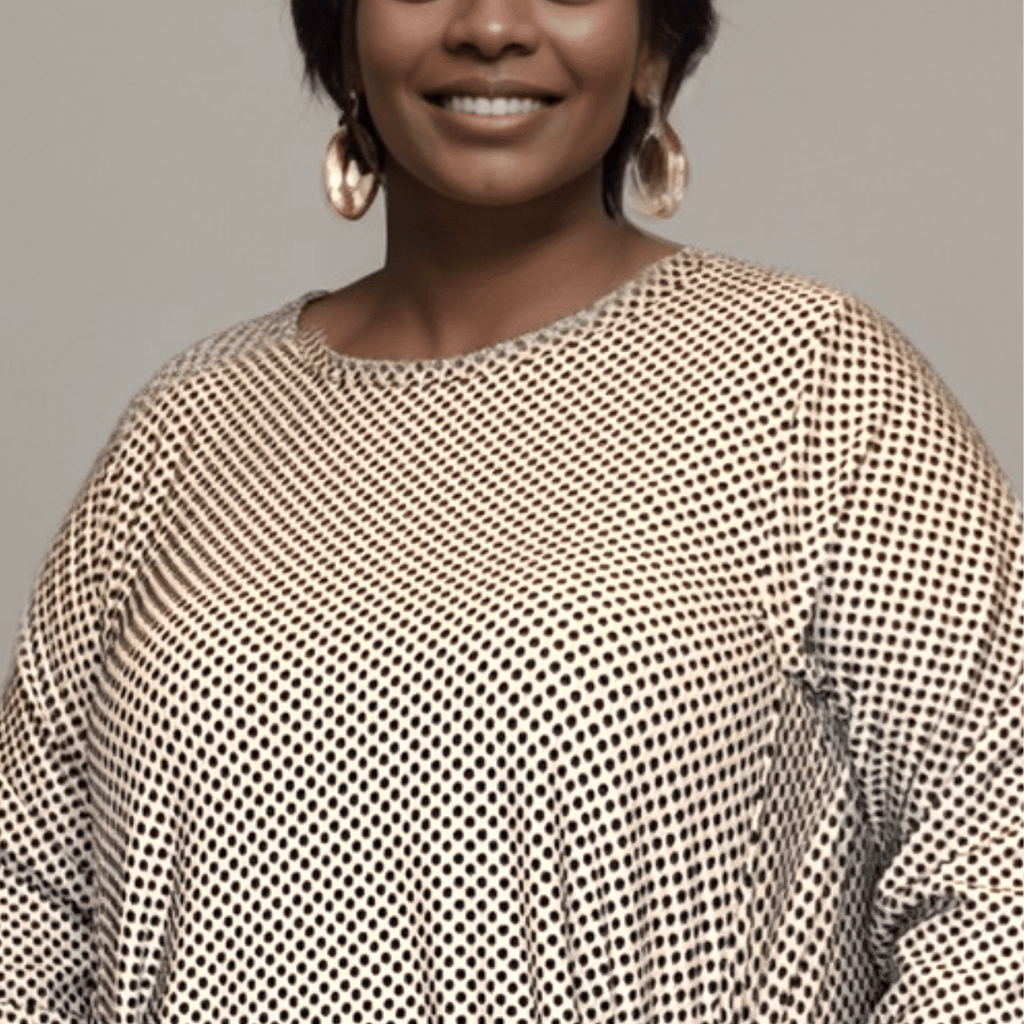Stylish mesh top featuring a unique pattern and relaxed fit.